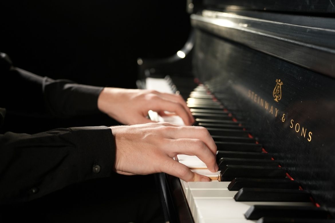 Fingers on a piano