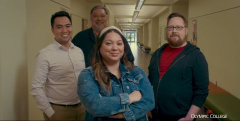 Four leadership students standing in a hallway